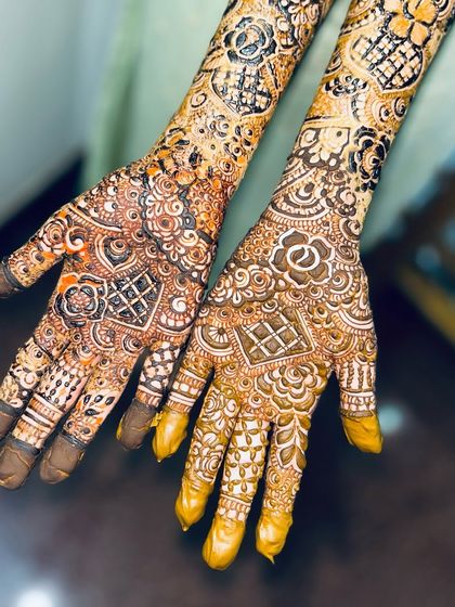 A close-up of the palms, showing the intricate details and the different textures created with lines, dots, and shading.