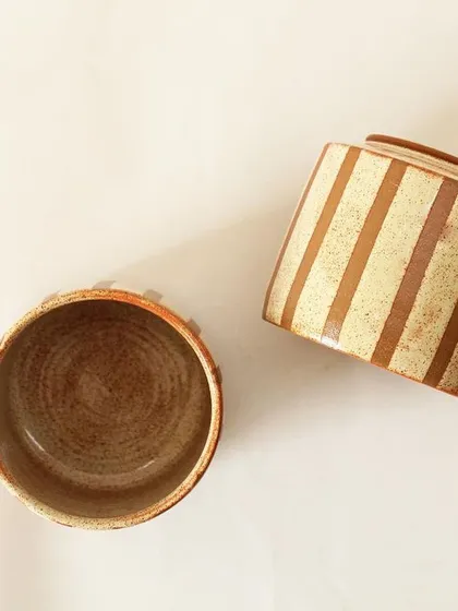 An overhead and side view of the Coffee Drip cups, showing the warm, earthy tones inside and out. These are durable, everyday pieces made with care.