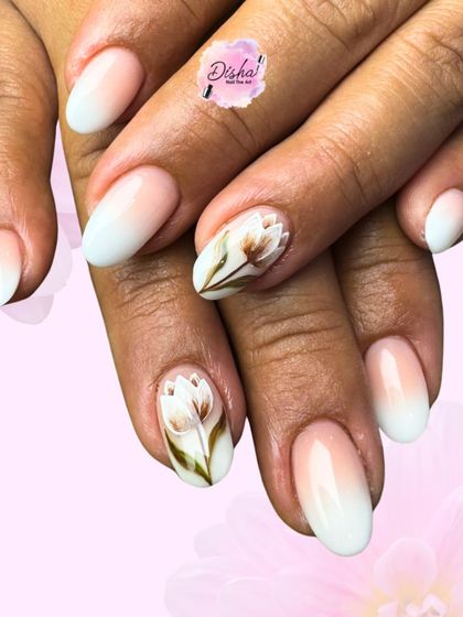 Freshly picked flowers on perfectly polished nails. This design features a soft white ombre base with beautifully detailed, hand-painted brown tulips.