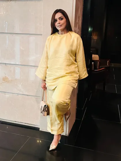 Leaning into the relaxed yet chic vibe of this yellow choga set. When styled with simple accessories and elegant heels, it becomes a sophisticated outfit for any traditional gathering.