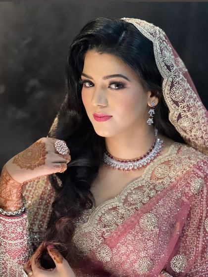 A beautiful engagement bride, with soft, subtle makeup that enhances her natural beauty.