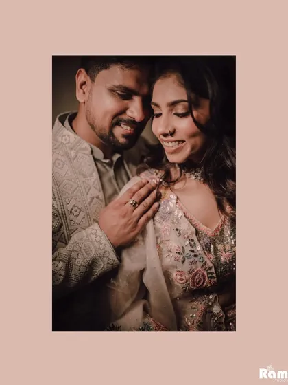 An intimate and warm portrait of a newly engaged couple. The soft lighting and their gentle smiles create a feeling of comfort and deep affection.