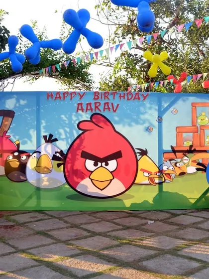 The main photo backdrop for an Angry Birds birthday, featuring all the popular characters from the game in a vibrant, playful scene.