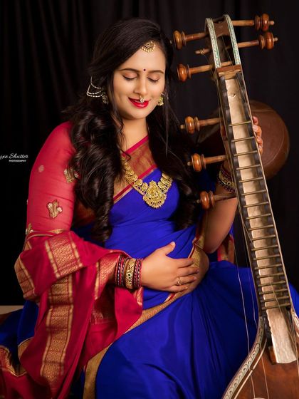 A close-up capturing the deep connection between the musician and her instrument, and the new life she is nurturing. It's a symphony of love.