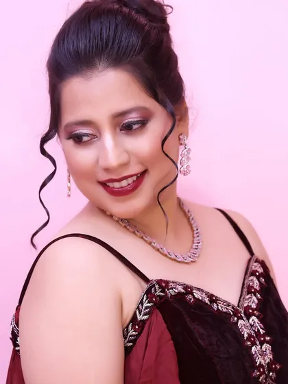 Makeup that makes you feel like a queen. This look features a dramatic smokey eye with a hint of shimmer and a deep red lip, perfect for a cocktail party.