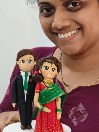 The joy of creation! A student from my workshop with the lovely couple topper she made, complete with a traditional green saree.
