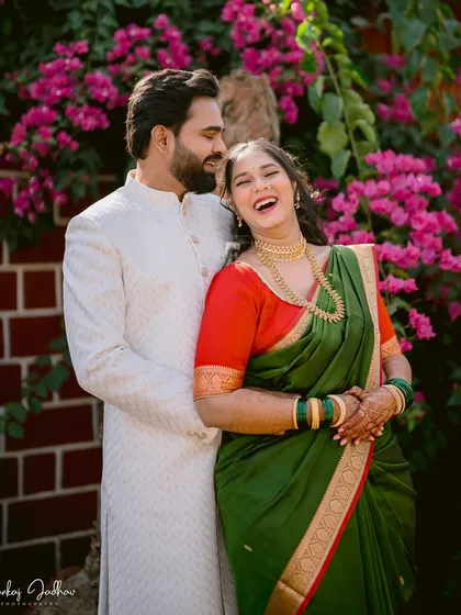 The sound of genuine laughter is my favorite thing to capture. This moment from Ankita and Shantanu's engagement in Satara, set against a backdrop of vibrant bougainvillea, is filled with the kind of unposed happiness I strive to find in every session.