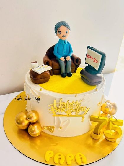 A customized cake for Papa's 75th birthday, showing him relaxing and watching the stock market.