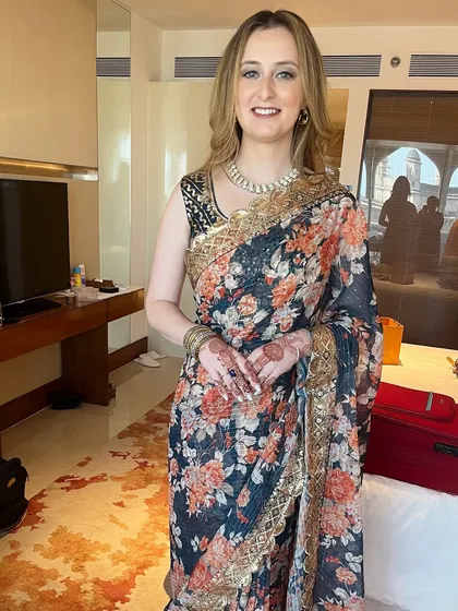 Sonya looking absolutely stunning in a floral Indian saree. The makeup is natural and enhances her features beautifully.