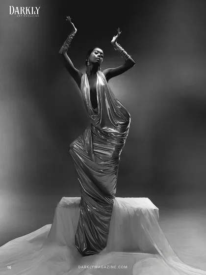 Another powerful shot from the "Ascension" series, where the pose and the lighting highlight the sleek hair and the defined, elegant makeup, creating a sense of divinity and movement.