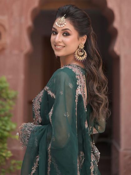 Another beautiful shot of this mehendi look, showing the golden glow and the way the makeup enhances her features in a natural, elegant way.