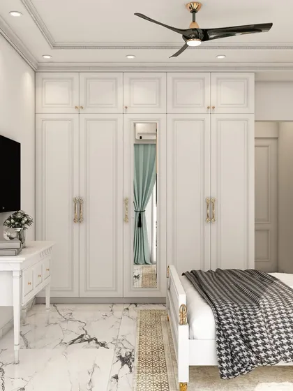 Another angle of the traditional bedroom, providing a better look at the spacious floor-to-ceiling wardrobe and the light, airy feel of the room.