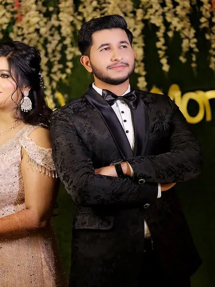 A modern and cool back-to-back pose. This shows the couple's confidence and partnership as they embark on their new journey.