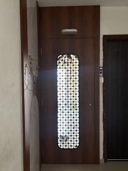 A different angle of the entrance, showing the light shining through the door's grill.