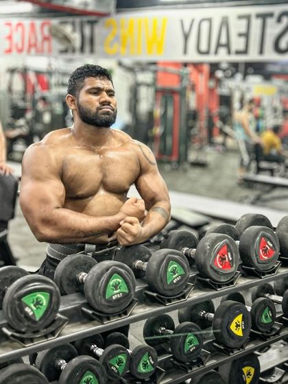 Eat, sleep, gym, repeat. A front pose showing the 2kg of muscle mass I've recently gained.