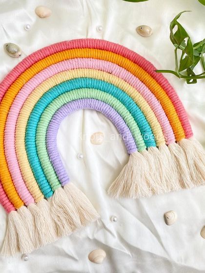 For those who love bright colors, this multi-colored rainbow is a burst of happiness! With eight vibrant arches, this large wall hanging makes a cheerful statement in any playroom or kid's bedroom.