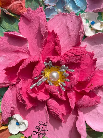 The magic is in the details. This extreme close-up of a sculpted pink peony reveals the delicate texture and paper-like thinness of each petal, complete with a pearl and silver-dusted center. This is the touchable quality that defines Russian sculpture art.