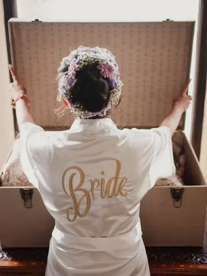 A classic "Bride" robe shot. We ensure that even the getting-ready moments are picture-perfect and memorable.