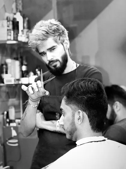 A black and white shot capturing the lifestyle of a barber. It's all about focus, precision, and passion.