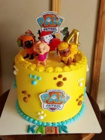 Paw Patrol is on a roll! This bright yellow cake is decorated with the beloved pups from the show, making it a perfect centerpiece for a young fan's birthday party.