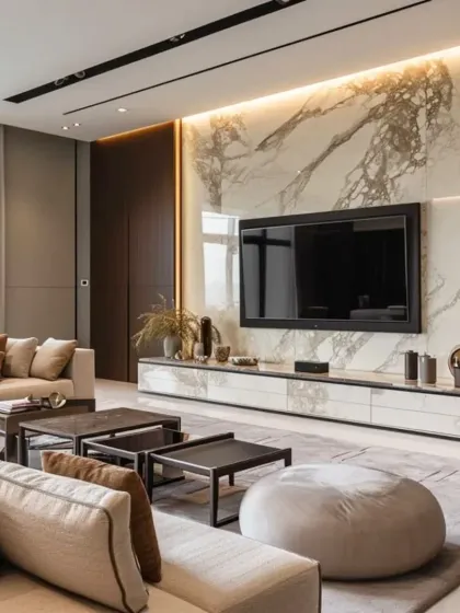 Here is a real project photo showing how I bring luxury designs to life. This living room features a stunning marble-paneled wall for the TV unit, complemented by a custom low-profile console and a comfortable L-shaped sofa.