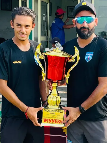 Another trophy in the cabinet. Holding the Challengers League final trophy with one of my senior players.