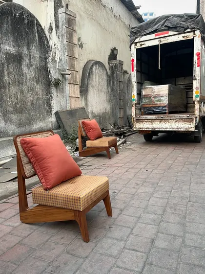 A pair of 'Kangaroo' chairs being loaded for delivery to a client.