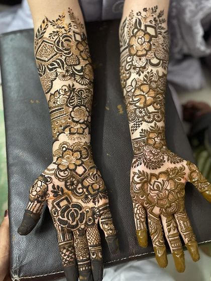 A special design for my phuppo. I used a mix of bold floral blocks and delicate, leafy vines that travel from the palm to the elbow, creating a rich and varied texture.