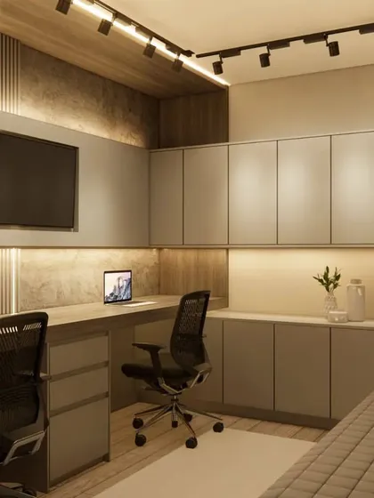 A shared study room or home office for two, with a long desk and plenty of overhead storage. The design uses a neutral grey palette and track lighting.