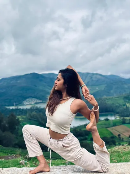 Practicing Eka Pada Rajakapotasana, or One-Legged King Pigeon Pose, surrounded by nature. For me, yoga is not just about the pose but about finding balance and stillness wherever you are.