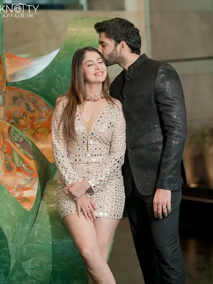 A sweet kiss on the forehead is a classic expression of love and affection. This tender moment with Malvika and Pranav is full of warmth and happiness, a perfect memory before their big day.