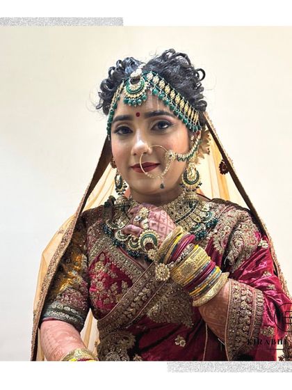 A beautiful bride on her wedding day. We created her entire look, from the elaborate hairstyle and jewelry setting to the flawless, long-lasting makeup.