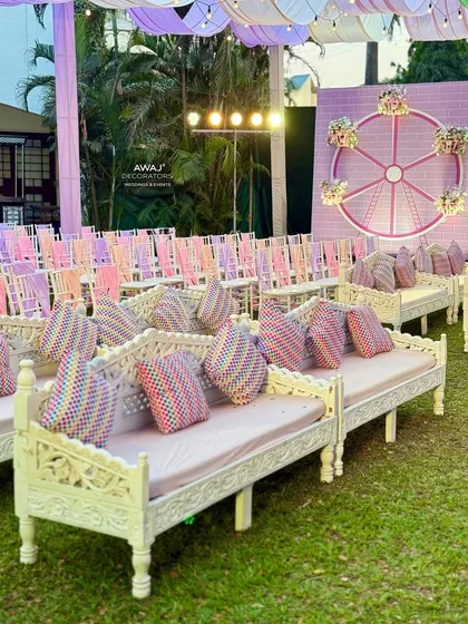 A row of the beautiful white benches, providing ample and stylish seating for guests.