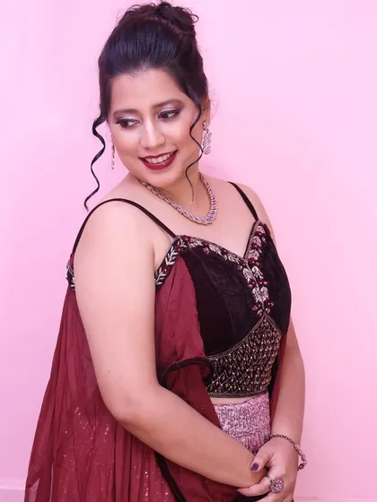 A final portrait from this shoot, capturing a soft smile and the beautiful details of the makeup and hair.