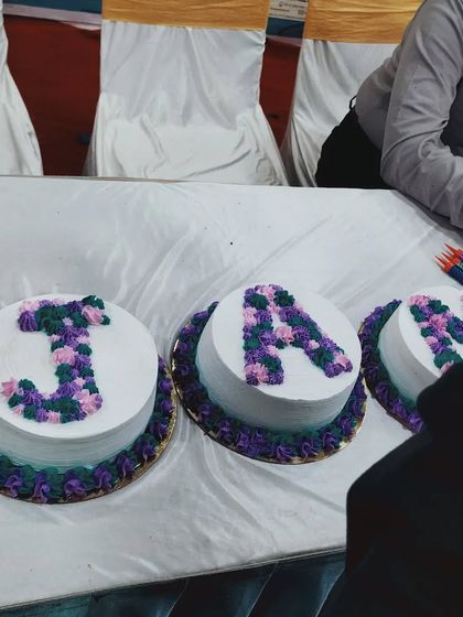 The alphabet cakes on the table at the event they were sponsored for.