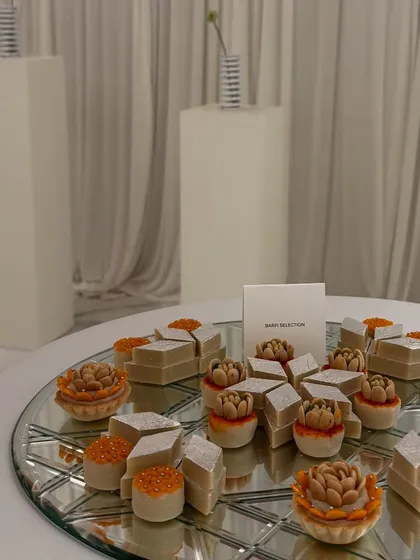 A modern take on Indian mithai, beautifully arranged on a mirrored platter. We love giving traditional sweets a contemporary spotlight in our event menus.