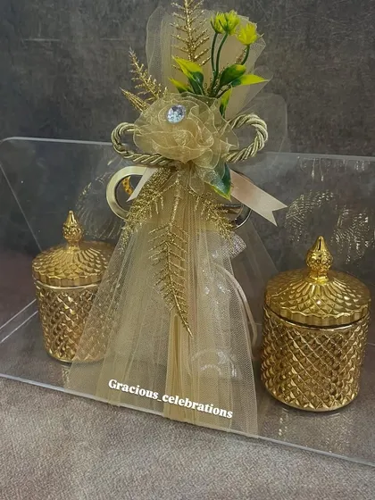 Another view of our premium acrylic bag wedding favor. The combination of the clear bag, golden jars, and elegant wrapping creates a very modern and luxurious gift.