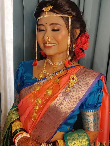 Priyanka embracing the Maharashtrian bridal look with the traditional 'mundavalya' across her forehead.