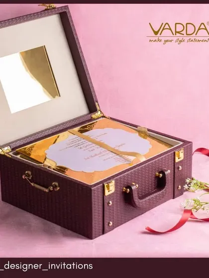 Celebrate a milestone anniversary with an invitation that is also a timeless gift. This briefcase-style invitation box combines luxury and utility, designed as a beautiful keepsake that reflects the importance and grandeur of the occasion.
