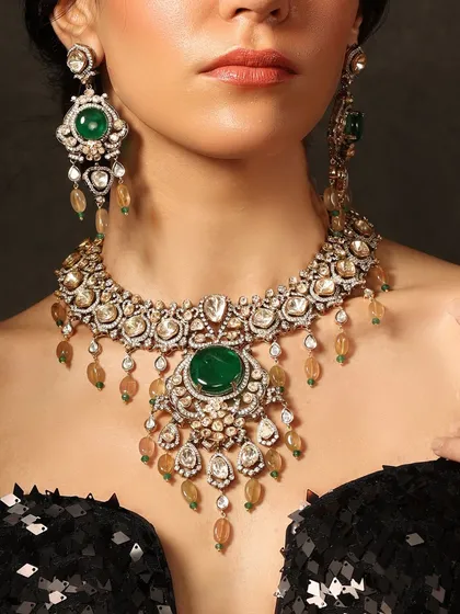 The timeless combination of emerald and polki in a grand, layered necklace set, perfect for a regal bridal look.