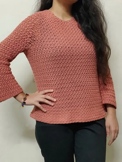 This is the Etoile Sweater, one of my favorite pieces to make. I love how it fits, and the star-stitch detail on the sleeves makes it so unique. We can create this custom handmade sweater for you in any color you like.
