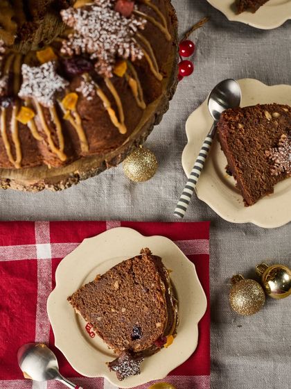 A slice of our rich and moist Maska Christmas Cake, filled with rum-soaked fruits and nuts. It's the perfect traditional treat to enjoy with family and friends.