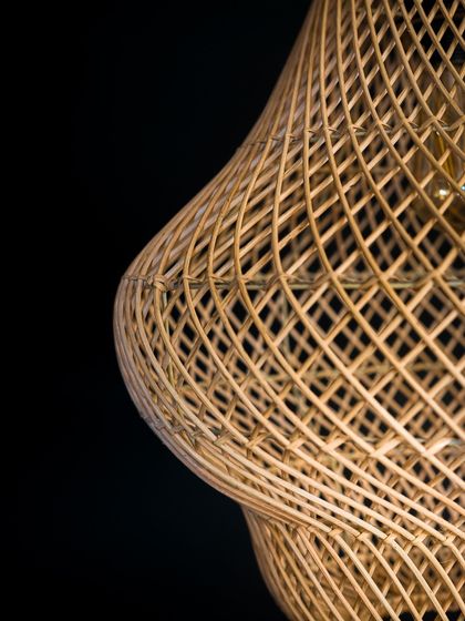 Another close-up of the gourd lamp's surface, showing the subtle undulations and the precision of the hand-woven rattan.