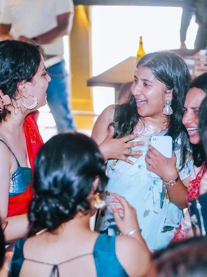 Friends sharing a moment of joy on the dance floor. This is what it's all about.