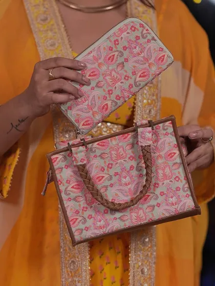 Bloom loud, bloom bold. This Wild Bloom handbag and matching wallet from Amyra is a botanical statement piece, perfect for days when your outfit needs a pop of personality.