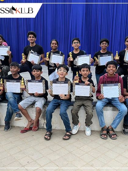 A group of our winners from the Universal First Age Category Children Chess Tournament. We had students winning prizes across multiple age sections, from Under 7 to Under 19.