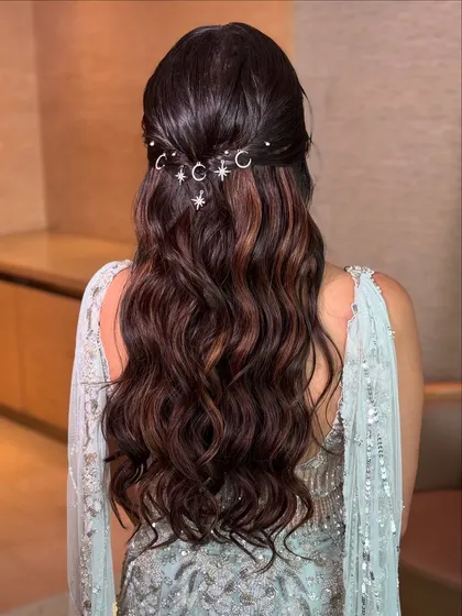 Let's make your hairstyle magical. For this dreamy reception look, I styled the hair in soft waves and added these whimsical moon and star charms. It’s a unique way to personalize your style and add a touch of celestial sparkle to your special night.