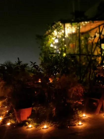 Another angle of the diyas, showing how simple lighting can completely transform a space and create a festive, sacred atmosphere.
