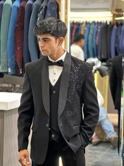 Another angle of the asymmetrical tuxedo, showing how it creates a sharp and fashion-forward silhouette.