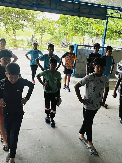 Our shooters performing body balance exercises. A stable stance is critical for precision shooting, and these drills are designed to strengthen core muscles and improve stability.